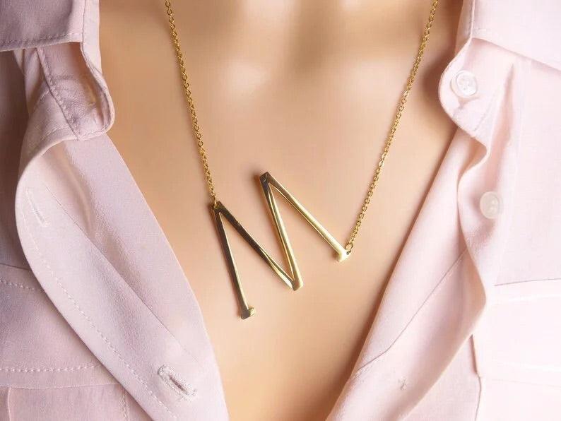 M necklace sideways on sale